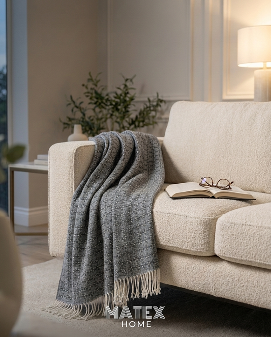 Slate Trellis Throw draped on a sofa