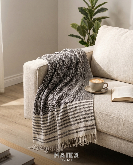 Espresso Ivory Throw draped on a sofa