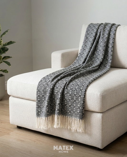 Graphite Trellis Throw draped on a sofa