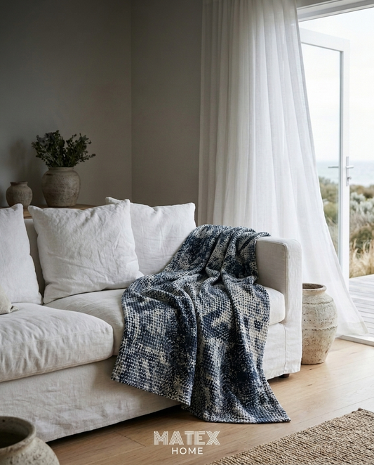 Blue Ash Waffle Blanket draped on a sofa
