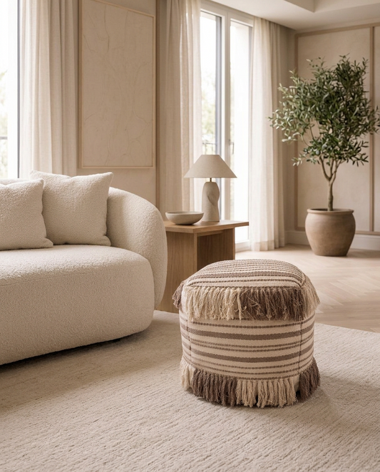 Nomad Fringe Pouf in a living room