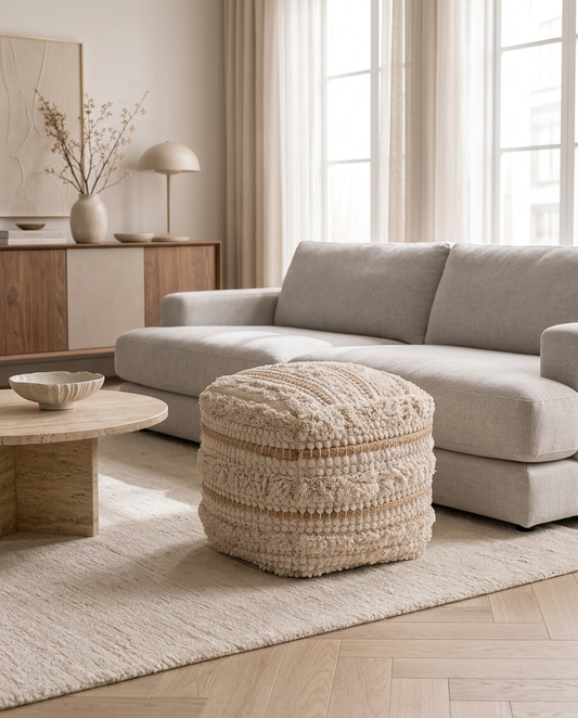 Tassara Ivory Pouf in a living room